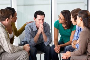 man-talking-with-small-group